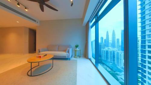 a living room with a couch and a table at Eaton Residence KLCC - KL SUITE in Kuala Lumpur