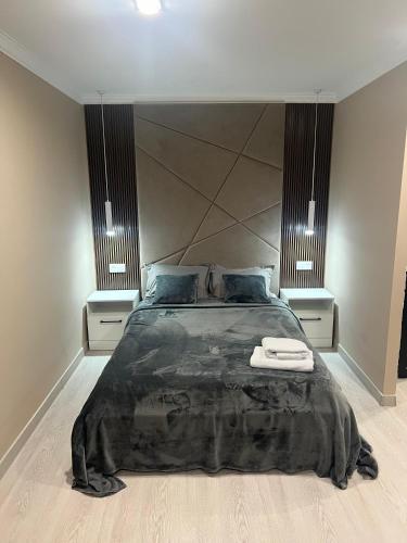 Llit o llits en una habitació de Алиханова 10А