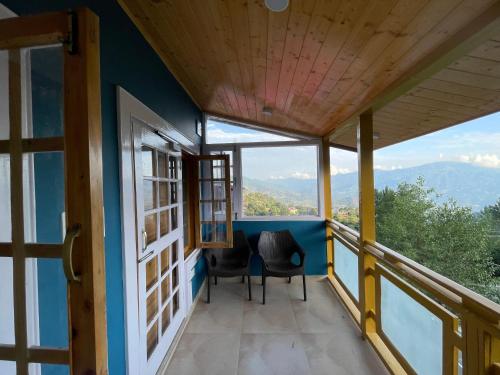 a balcony with a view of the mountains at Vacay Datcha 1 double room in Kūd
