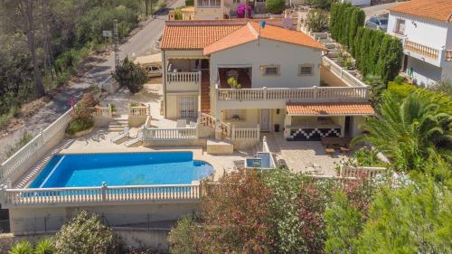 an aerial view of a house with a swimming pool at Retiro Sol - Casa Joni in Orba