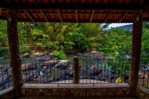 a view of a river from a balcony at Chácara Tedeschi in Monte Alegre do Sul