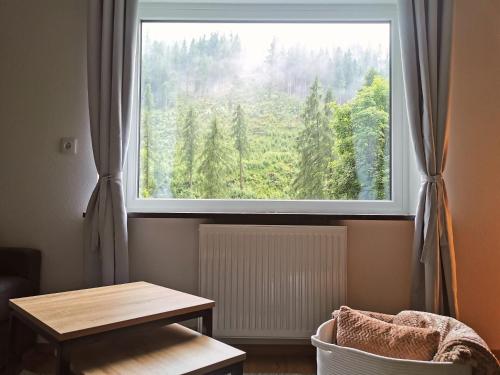 a window with a view of a forest at Apartment Christl in Sankt Jakob in Defereggen