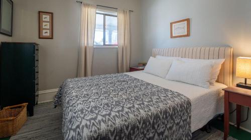 a bedroom with a bed and a window at 7th Street Bungalow in Livingston