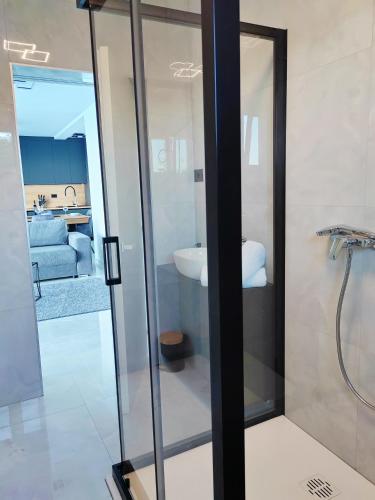 a bathroom with a toilet and a sink in a room at Villa Sea level with BEAUTIFUL VIEW, Medveja in Lovran