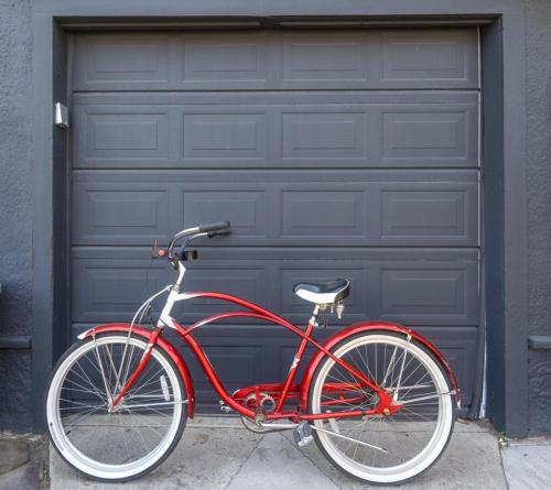 a red bike parked in front of a garage at Fisherman's Bungalow in Livingston