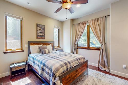 a bedroom with a bed and a ceiling fan at Cochise Charms in South Lake Tahoe