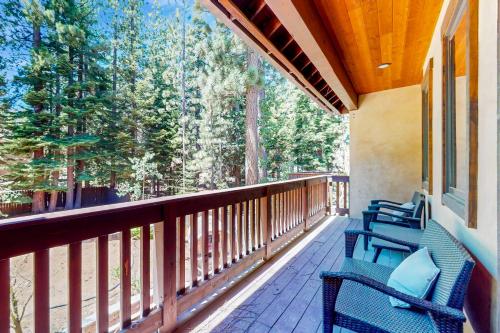 a porch with blue chairs on a balcony at Cochise Charms in South Lake Tahoe