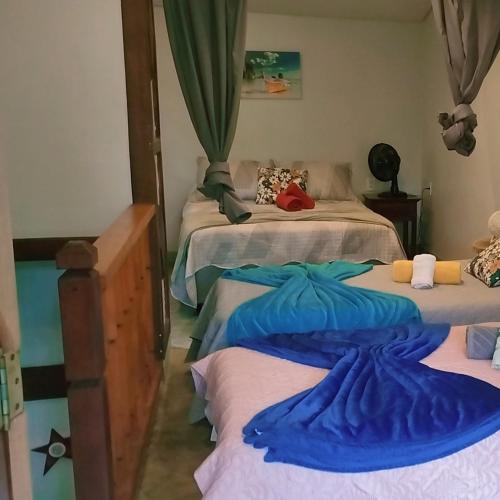 En eller flere senge i et værelse på Estrela da noite