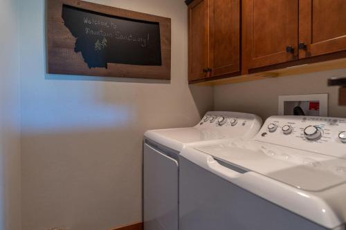 a white washer and dryer in a laundry room at Mountain Sanctuary in Livingston