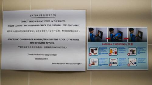 two signs hanging on a wall in a room at Eaton Residence KLCC - KL SUITE in Kuala Lumpur