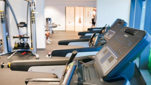 a row of treadmills in a gym at Eaton Residence KLCC - KL SUITE in Kuala Lumpur
