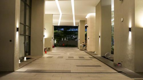 a hallway of an office building with ailed floor at Eaton Residence KLCC - KL SUITE in Kuala Lumpur