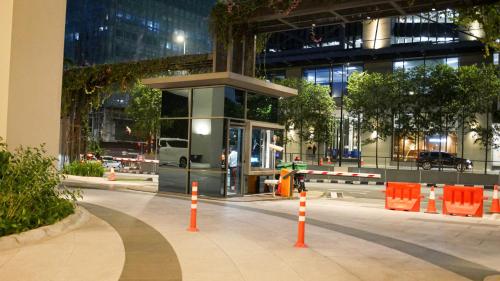 a city street with orange cones in front of a building at Eaton Residence KLCC - KL SUITE in Kuala Lumpur