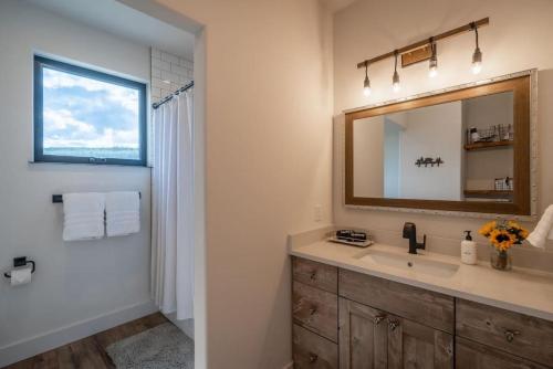 a bathroom with a sink and a mirror at Double MM Ranch in Emigrant