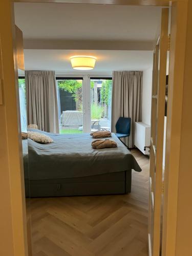 a bedroom with a bed and a window at B&B Schiphol Amsterdam in Rijsenhout