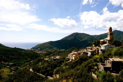 a view of a town on a hill with mountains at Agriturismo I Pipetta in Levanto