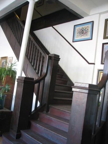 a staircase in a house with wooden steps at The Downtown Lovely in Livingston
