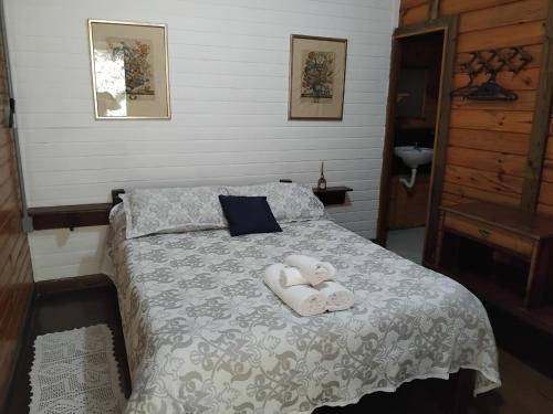 En eller flere senge i et værelse på Pousada Florada na Serra - Apto 9