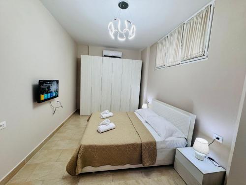 Postel nebo postele na pokoji v ubytování Edi Apartament Center