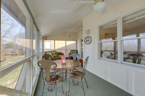 a dining room with a table and chairs at Lake Cumberland Resort Condo with Direct Lake Access in Burnside