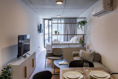 a living room with a couch and a table at Baliñas Boutique in Montevideo