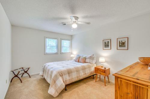 a bedroom with a bed and a ceiling fan at Spacious Home with Porch, 4 Mi to Downtown Clemson! in Central