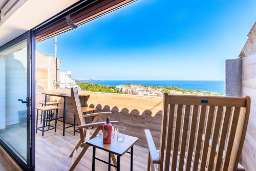 a balcony with a table and chairs and a view of the ocean at Panoramic by Unik Vacation in Tarragona