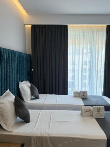 Ein Bett oder Betten in einem Zimmer der Unterkunft HOTEL BAR RESTORANT YLLI