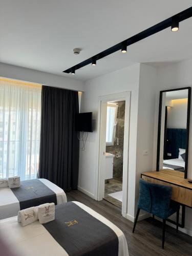 Ein Bett oder Betten in einem Zimmer der Unterkunft HOTEL BAR RESTORANT YLLI