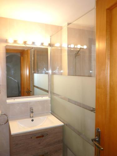 a bathroom with a sink and a mirror at Playamar in Alcossebre