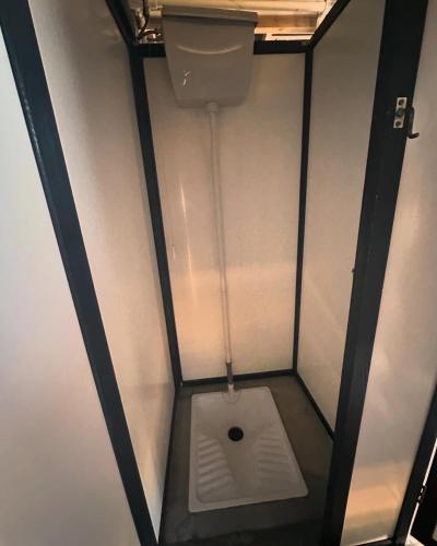 a bathroom with a toilet in a room at Oaza de Corbu in Corbu
