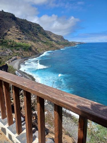 a view of the ocean from a wooden balcony at La Era de Catuja in Los Realejos