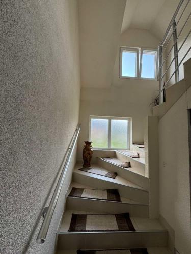 a room with stairs with a vase sitting on them at Apartment Mountain Paradise Plav in Plav