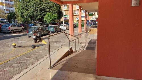 a motorcycle parked on the side of a street at Beautiful flat in Benalmádena