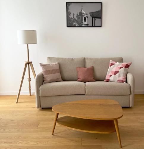 a living room with a couch and a coffee table at Senhora da Praça in Gavião