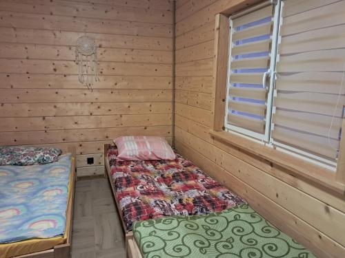 Postel nebo postele na pokoji v ubytování Sosnowy Zakątek Bis