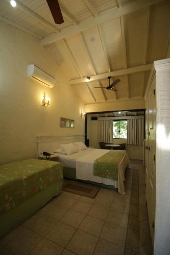 Postel nebo postele na pokoji v ubytování Ecoresort Refúgio Cheiro de Mato