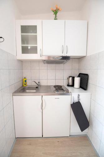 Η κουζίνα ή μικρή κουζίνα στο Studio Apartmani M