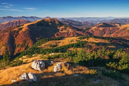 a view of a mountain range with rocks and trees at Vila Harmónia in Turčianske Teplice