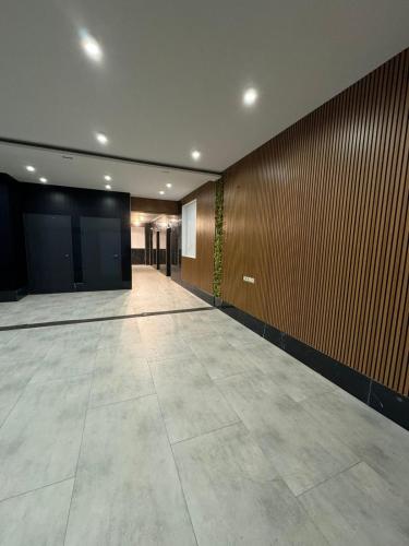 an empty hallway in a building with a wall at Moonlight Apart-Hotel Batumi in Batumi
