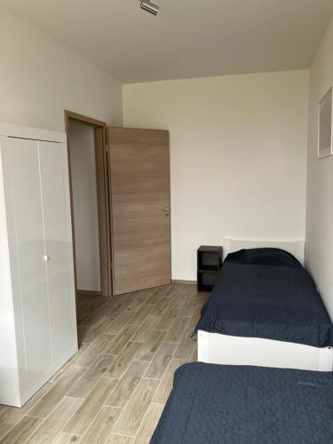 Postel nebo postele na pokoji v ubytování Primo Apartman