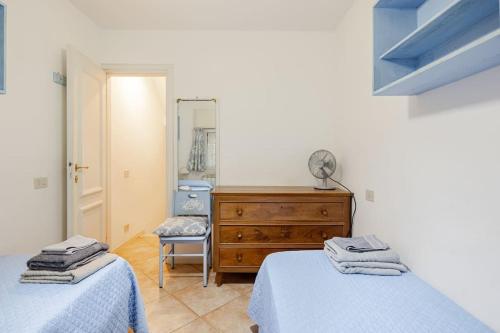 Katil atau katil-katil dalam bilik di Spaziosa casa con giardino e dependance