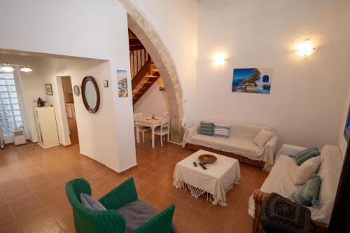 a living room with a couch and chairs and a table at Villa Irini in Kallithea Rhodes
