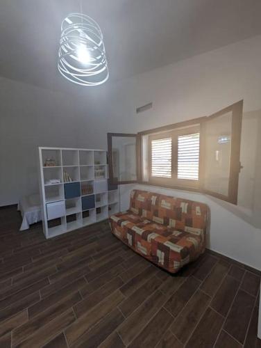 a living room with a couch in a room at Il Ruderino in Melito di Porto Salvo