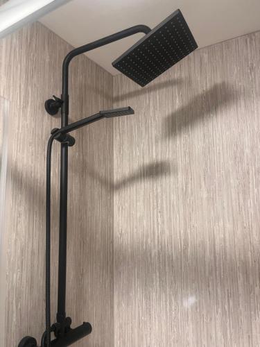 a shadow of a person holding a lamp at Tumbledown Hotel in Shrewsbury