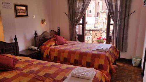 Katil atau katil-katil dalam bilik di Hotel Huasi Continental