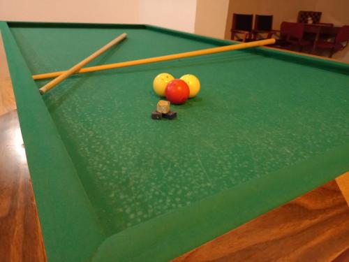 a group of cue balls on a pool table at Hotel El Cid Plaza Premium in Tunja
