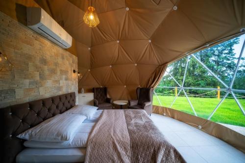 Letto o letti in una camera di Diamond Glamp & Jacuzzi