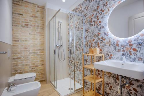 a bathroom with a sink and a shower at La Terrazza sul Vigneto in Offida