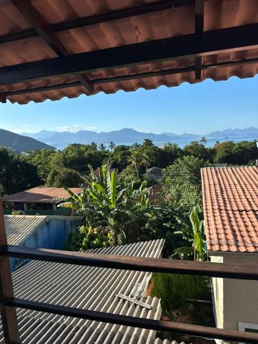 a view from the balcony of a house with a swimming pool at Paraíso das Flores in Abraão